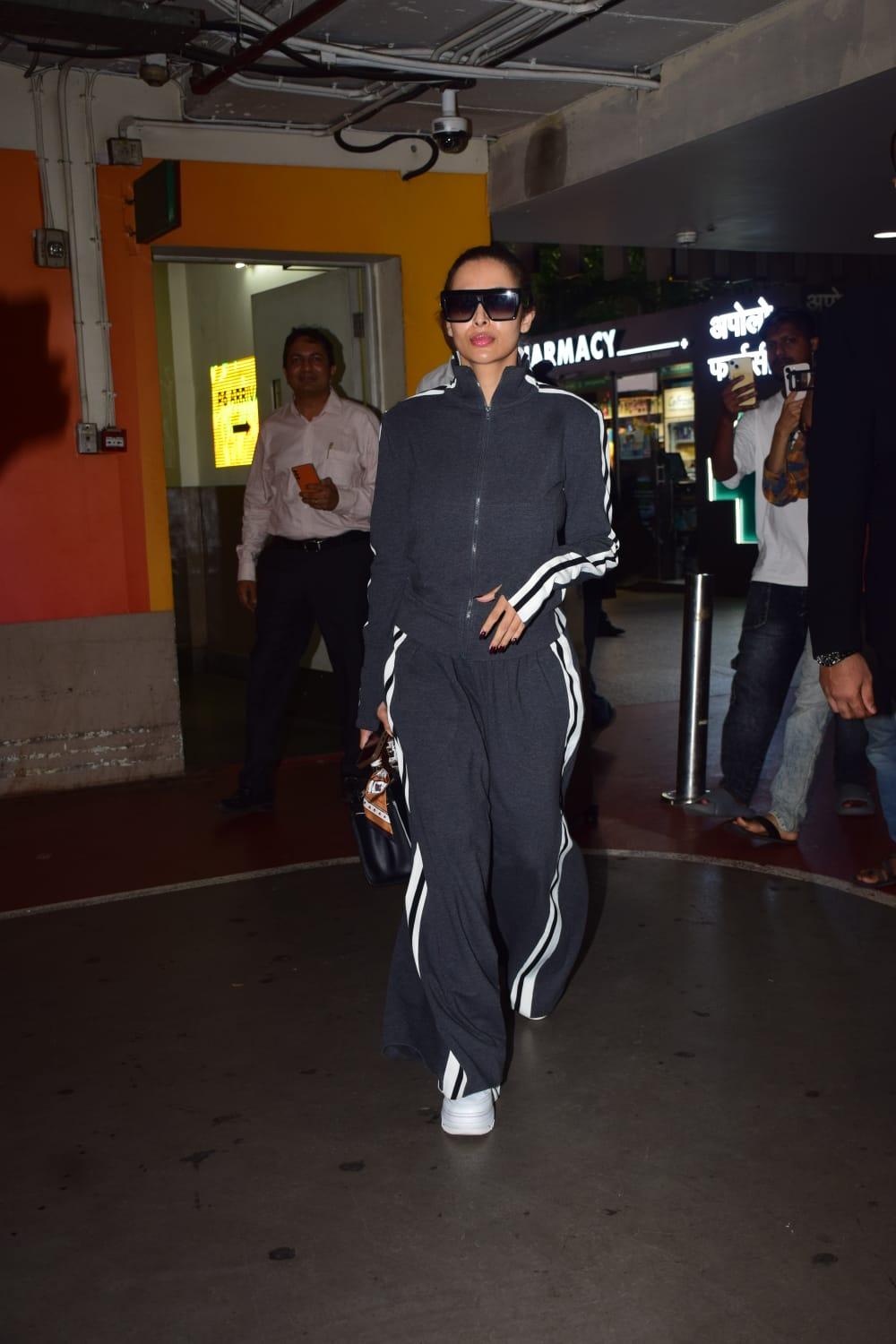Malaika Arora was spotted at the airport as she arrived in the city. She wore a black tracksuit along with huge black sunglasses.